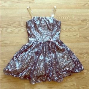 A beautiful strapless tan event dress with glitter